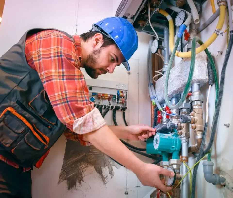 technician installing new heat pump